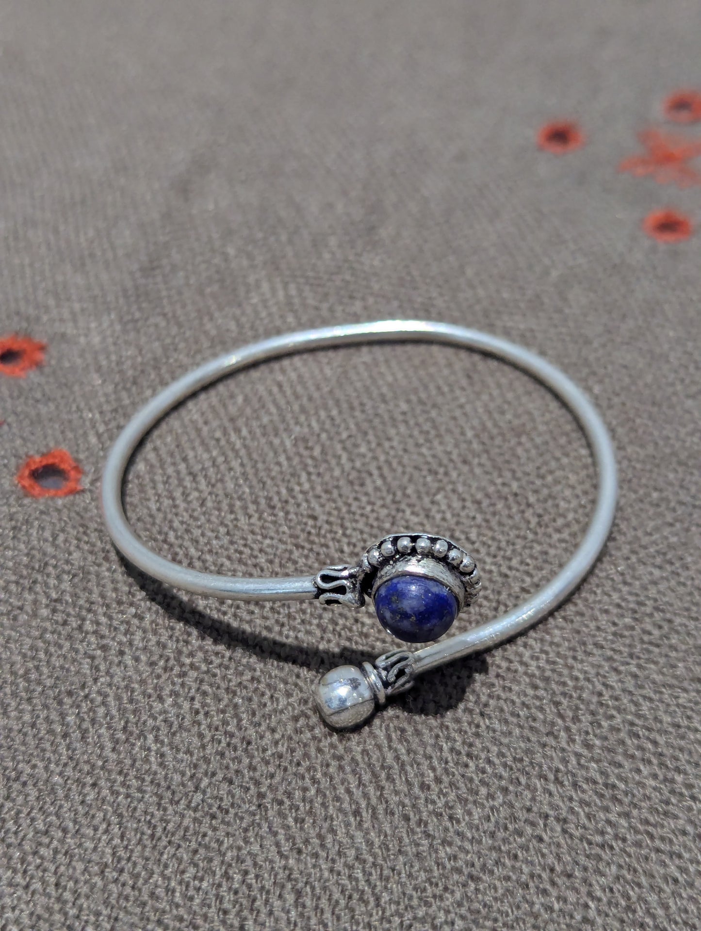 Make this Oxidized Silver Adjustable bracelet part of your vintage jewellery collection. Patinas highlight the Aztec style designs surrounding the navy blue stone. Great for gifts as well as a self-love piece. 